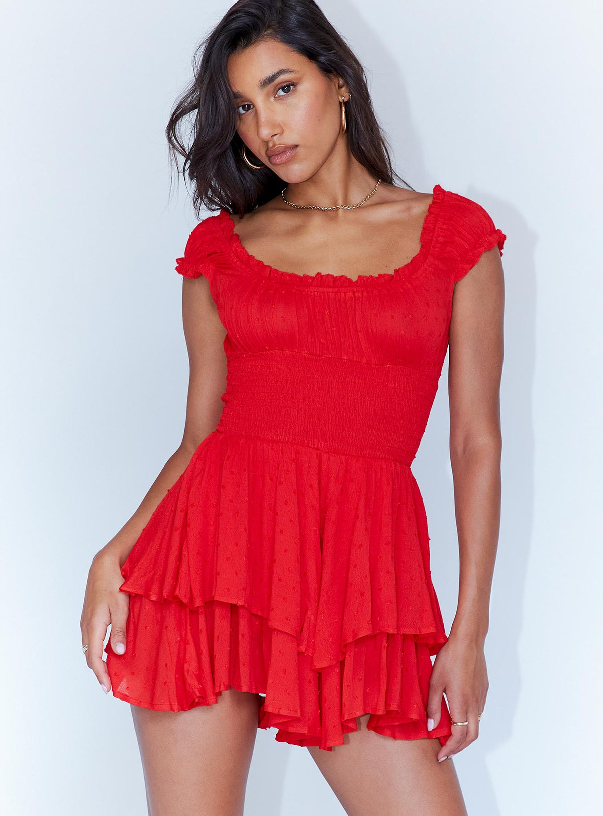 Romper Soft textured material Shirred waistband Ruffle detailing Elasticated neck and sleeves Good stretch   Fully lined